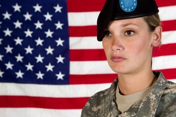 woman soldier with American flag background